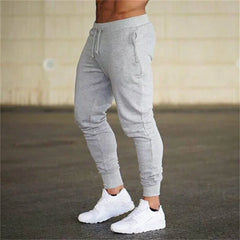 2025 Fashion Men Gyms Pure color Pants Joggers Fitness Casual Long Pants Men Workout Skinny Sweatpants Jogger Tracksuit Trousers